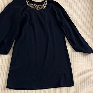 Elegant Navy Dress with Geometric Necklace